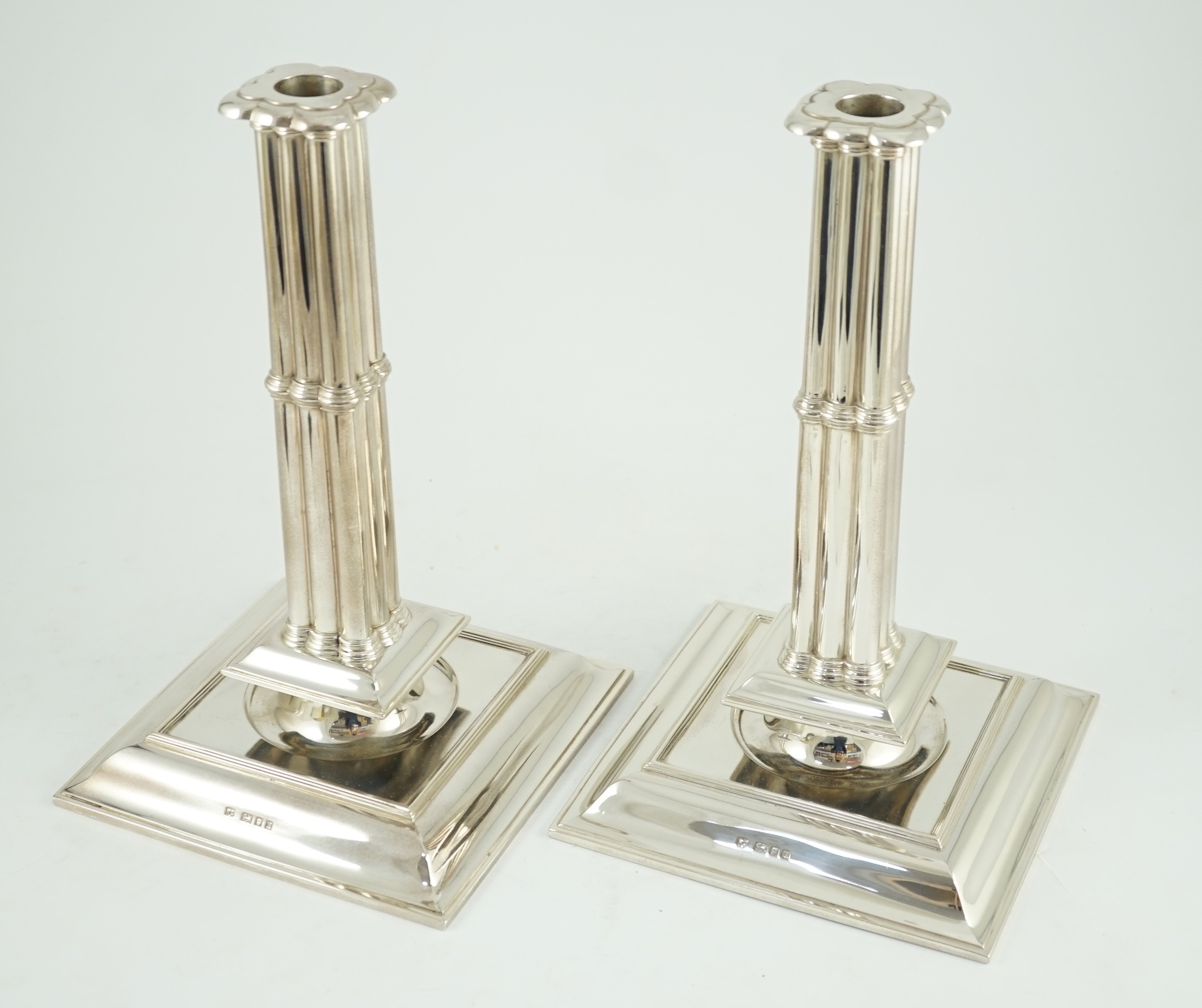 A large pair of George V silver cluster column candlesticks, by William Comyns & Sons Ltd